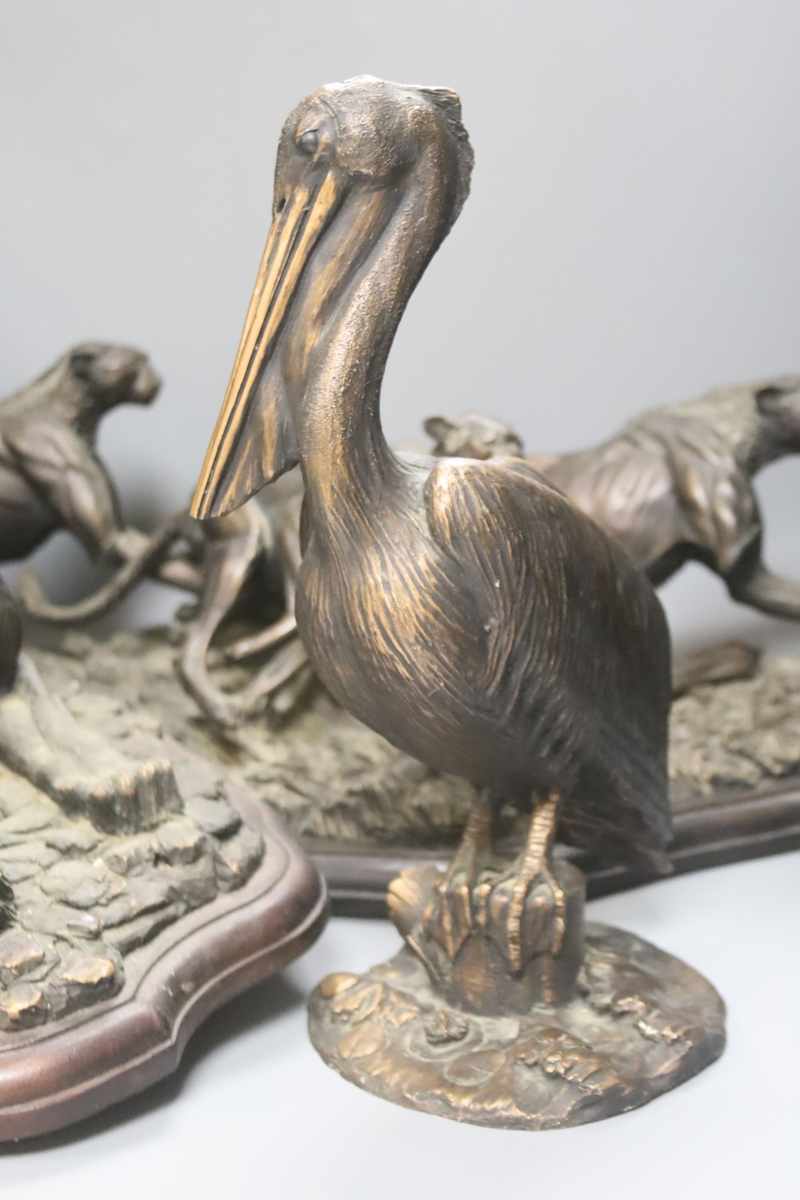 Tim Nicklin, three bronzed resin models of animals, Four cheetahs, 6/10, Pelican, 5/20 and Lioness, 2/10, largest 73cm, all with some degree of damage